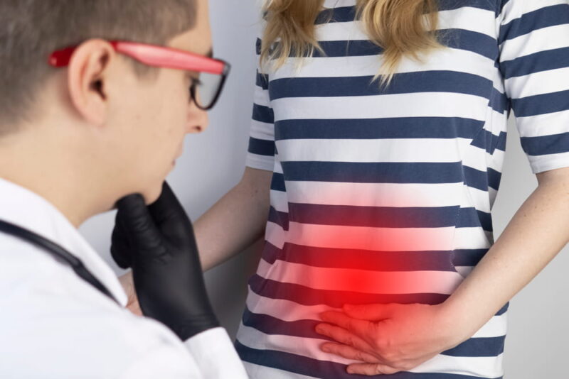 A woman suffers from pain in the pelvic organs. The gynecologist examines the patient. Painful location, female disease, cystitis, or urinary incontinence. On examination by a doctor